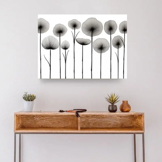 Tableau noir et blanc de fleurs séchées et végétaux, composition délicate et naturelle