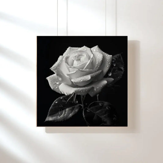 Tableau noir et blanc d’une rose en nature morte, composition florale élégante et intemporelle