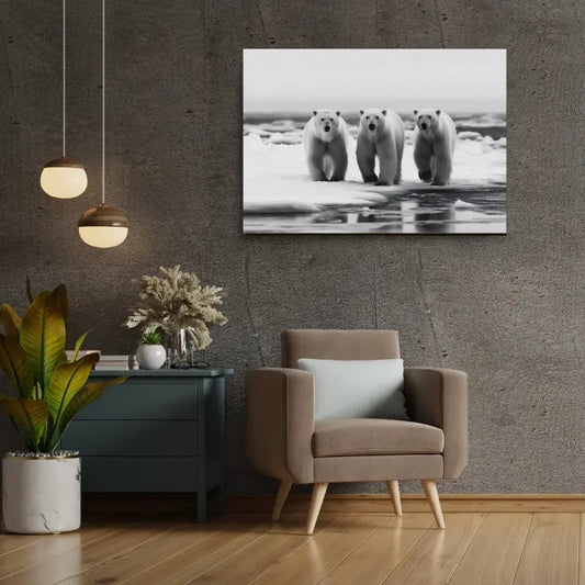 Un salon moderne comprend un fauteuil gris, une table d'appoint verte avec des plantes et le Tableau Famille Ours Polaires Noir et Blanc au mur, ajoutant une touche d'élégance à la décoration intérieure.