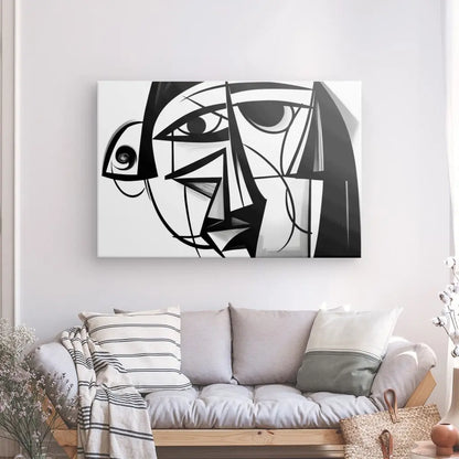 Un salon moderne avec un canapé beige orné de coussins rayés. Un grand Tableau Abstrait Style Picasso Cubisme Moderne Noir et Blanc est accroché au mur au-dessus du canapé.