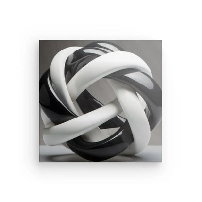 Une sculpture abstraite brillante en noir et blanc comportant des boucles entrelacées sur un fond neutre, parfaite comme Tableau Géométrique Moderne Lacets Noirs et Blancs.