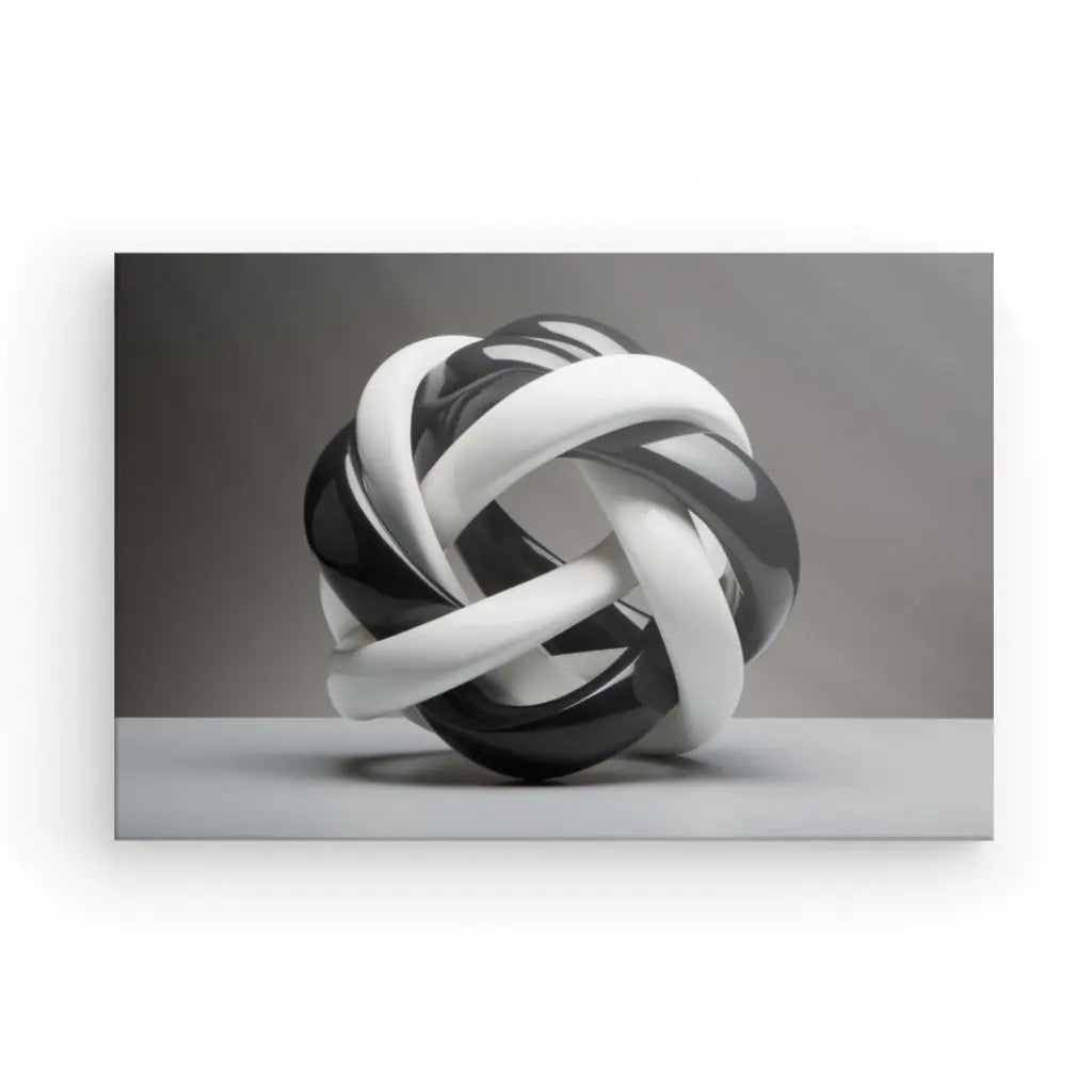 Une sculpture abstraite entrelacée en noir et blanc avec une finition brillante repose sur une surface plane sur un fond uni, ressemblant à l'élégance d'un Tableau Géométrique Moderne Lacets Noirs et Blancs.