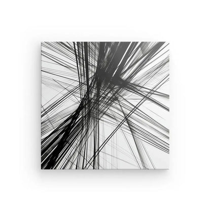 Ce Tableau Moderne Lignes Abstraites Noir et Blanc présente des lignes noires qui se croisent sur un fond blanc, créant un motif chaotique et dynamique qui illustre l'art abstrait, parfait pour la décoration contemporaine.