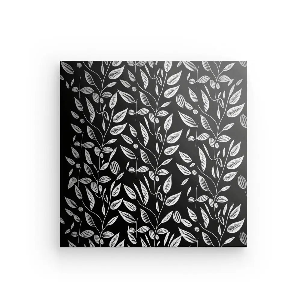 Un Tableau Végétation Plantes Grimpantes Minimalistes Noir et Blanc carré en noir et blanc présentant un motif répétitif de feuilles et de branches blanches sur fond noir.