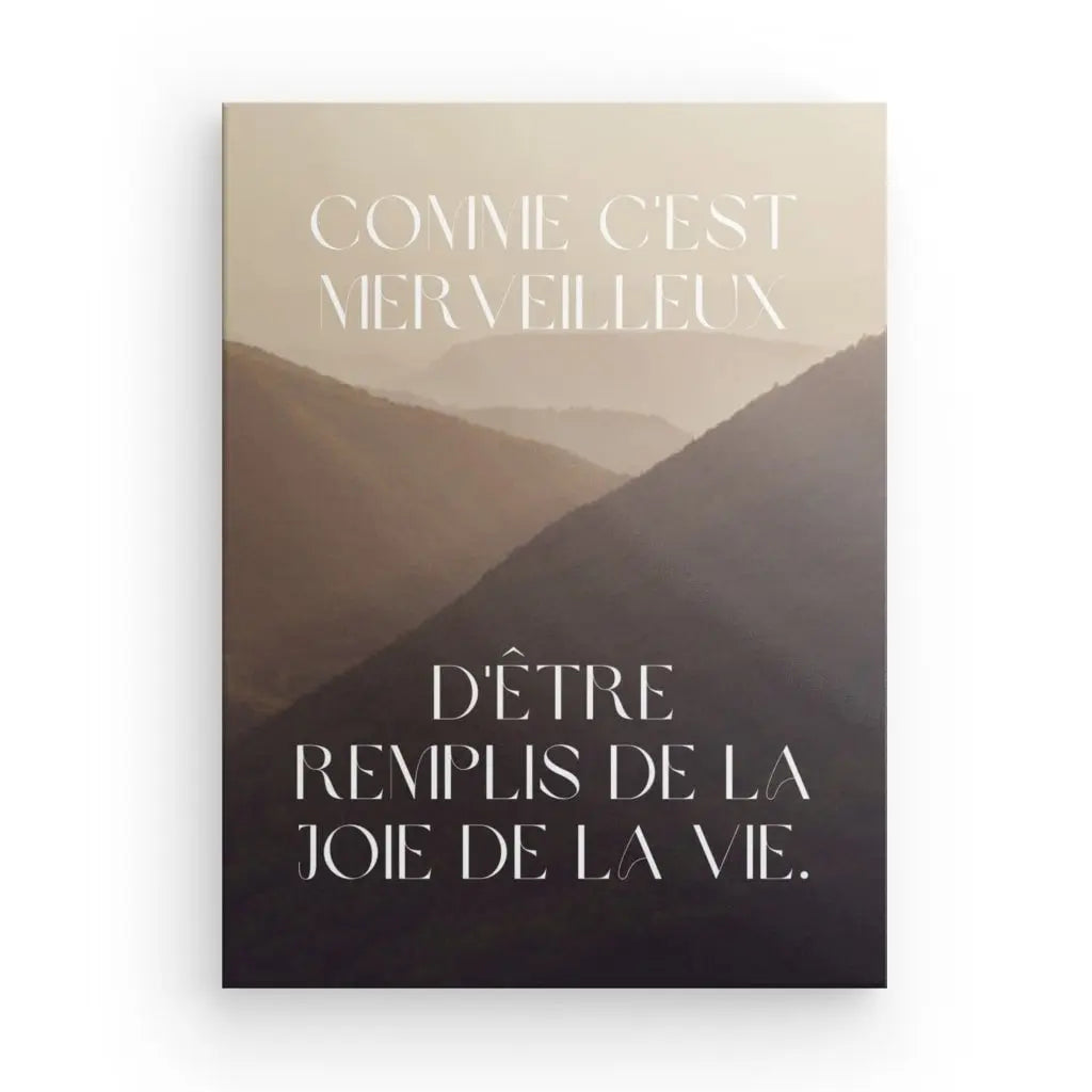 Inspiring wall art with "joie de vivre" quote and mountain background.