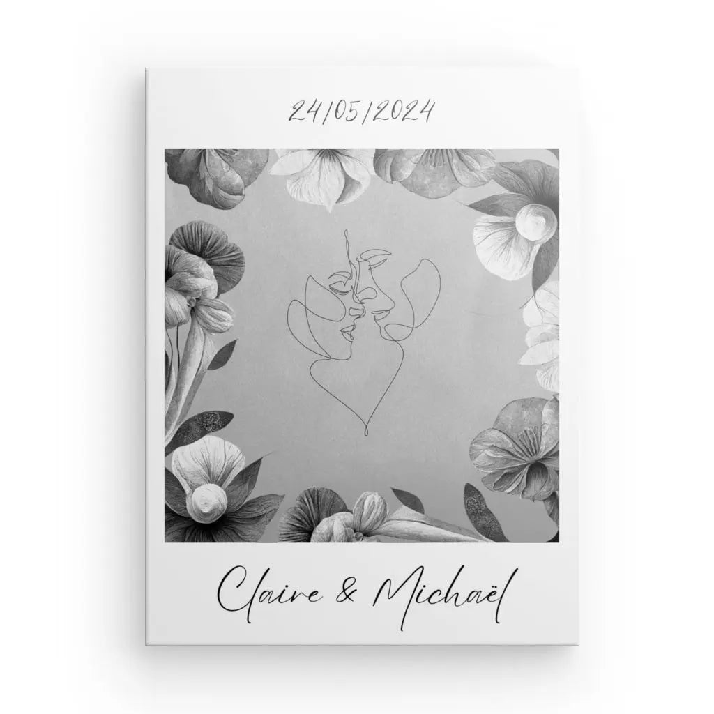 Une invitation de mariage comportant un dessin au trait monochrome de deux visages entourés d'élégants motifs floraux. La date « 24/05/2024 » orne le haut, tandis que « Claire & Michaël » est joliment inscrite en bas. Idéal pour être présenté sur une toile de qualité supérieure ou comme Tableau Personnalisé Couple Nom et Date Monochrome.