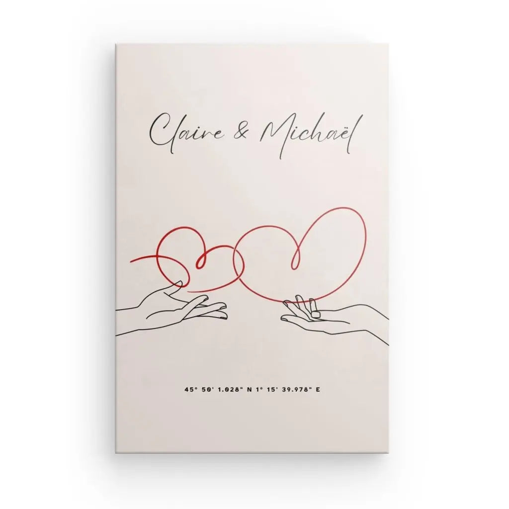 Une illustration minimaliste sur toile de qualité supérieure montre deux mains avec un fil rouge formant deux cœurs reliés. Les noms "Claire & Michaël" sont écrits ci-dessus, avec les coordonnées géographiques ci-dessous, capturant l'essence de l'amour minimaliste dans un Tableau Personnalisé Amour Minimaliste.