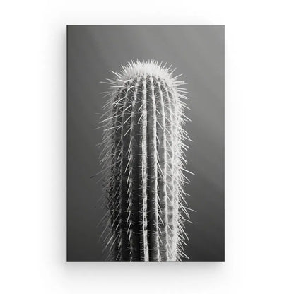 Photographie d'un cactus saguaro en noir et blanc, prise dans une perspective rapprochée qui accentue ses épines et ses crêtes verticales. Ce "Tableau Cactus Gros Plan Minimaliste Monochrome" ajoute une touche d'art minimaliste, le rendant idéal pour une décoration contemporaine.