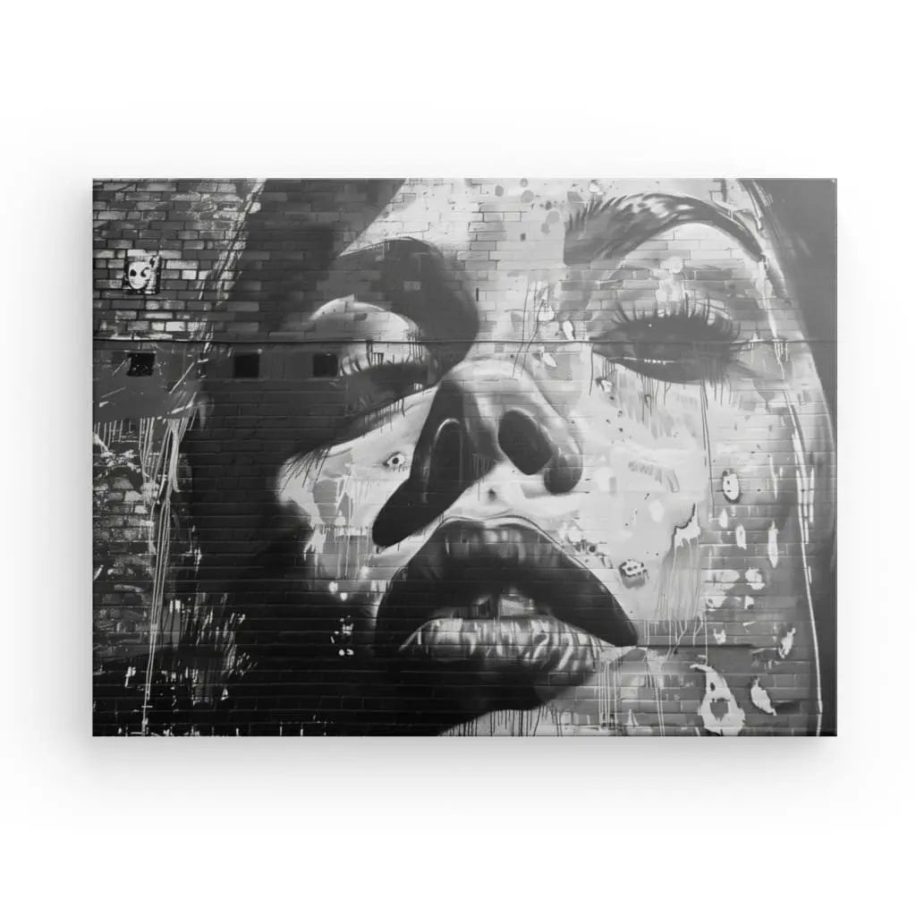 Black and white urban mural of a woman's face.