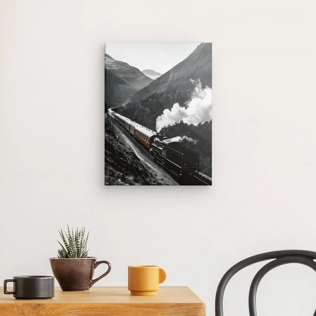 Monochrome wall art of vintage steam train in scenic landscape.