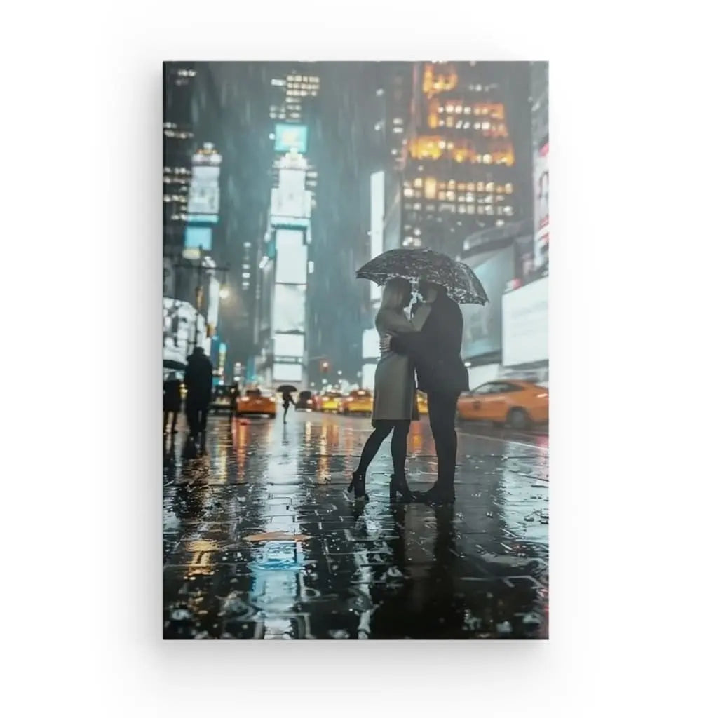 Romantic couple embracing under an umbrella in Times Square at night.