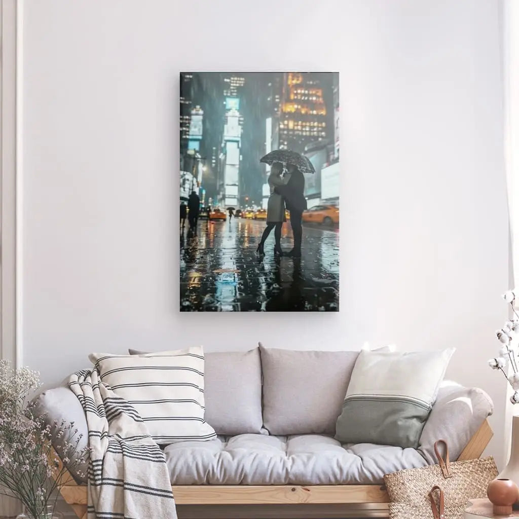 Couple embracing under an umbrella in Times Square artwork.