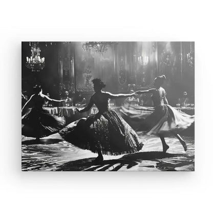 Dancers in elegant gowns performing in a vintage black and white scene.