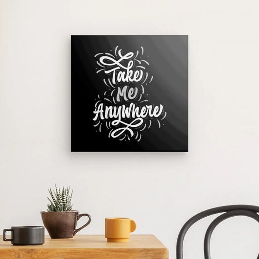 Tableau en noir et blanc avec la citation "Take me anywhere", message inspirant et poétique pour décoration murale