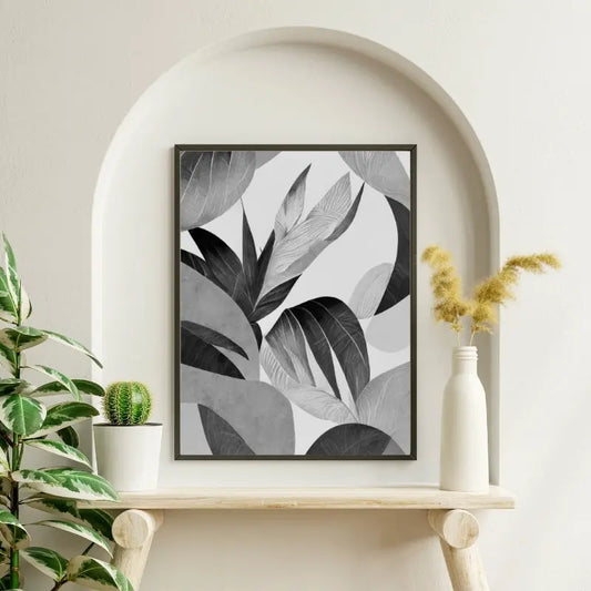 Tableau noir et blanc moderne représentant des feuilles végétales, design naturel et épuré