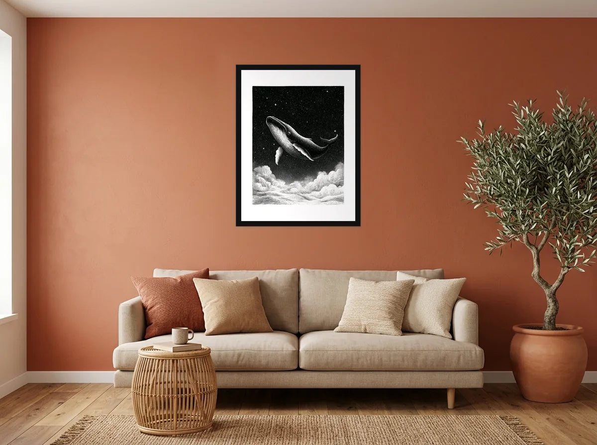 Poster baleine au-dessus des nuages noir et blanc encadré noir, présenté dans : salon aux murs terracotta