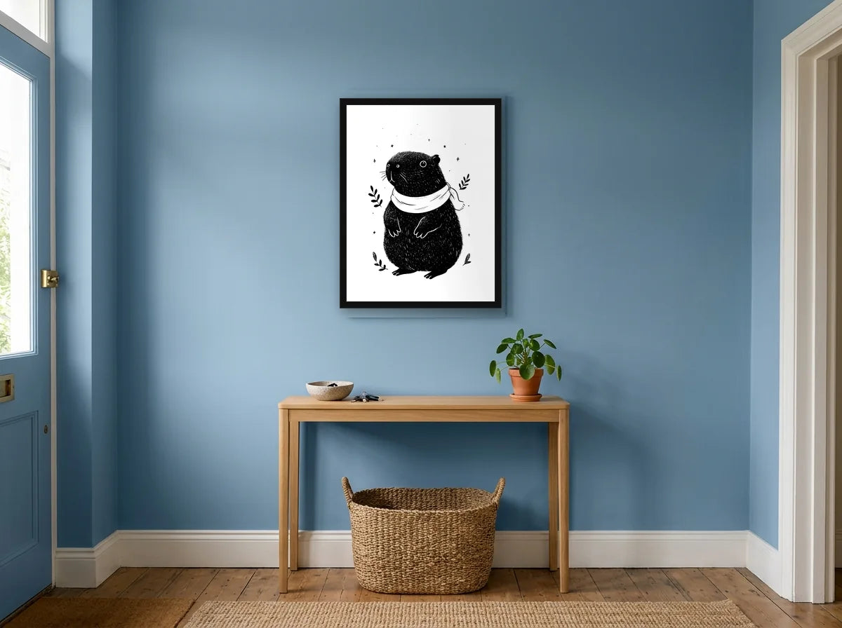 Poster capybara aventurier noir noir et blanc encadré noir, présenté dans un intérieur lumineux