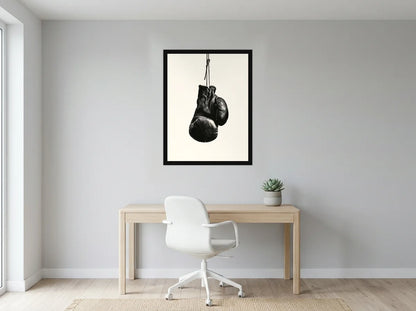 Poster Gants de Boxe Patinés noir et blanc encadré noir, présenté dans un bureau gris clair lumineux