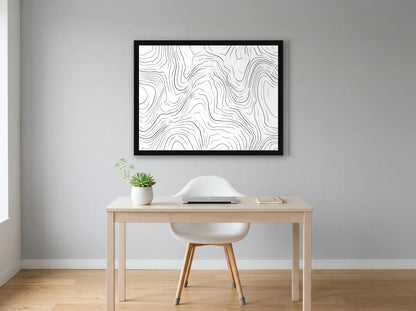 Poster lignes topographiques abstraites noir et blanc encadré noir, présenté dans un intérieur lumineux