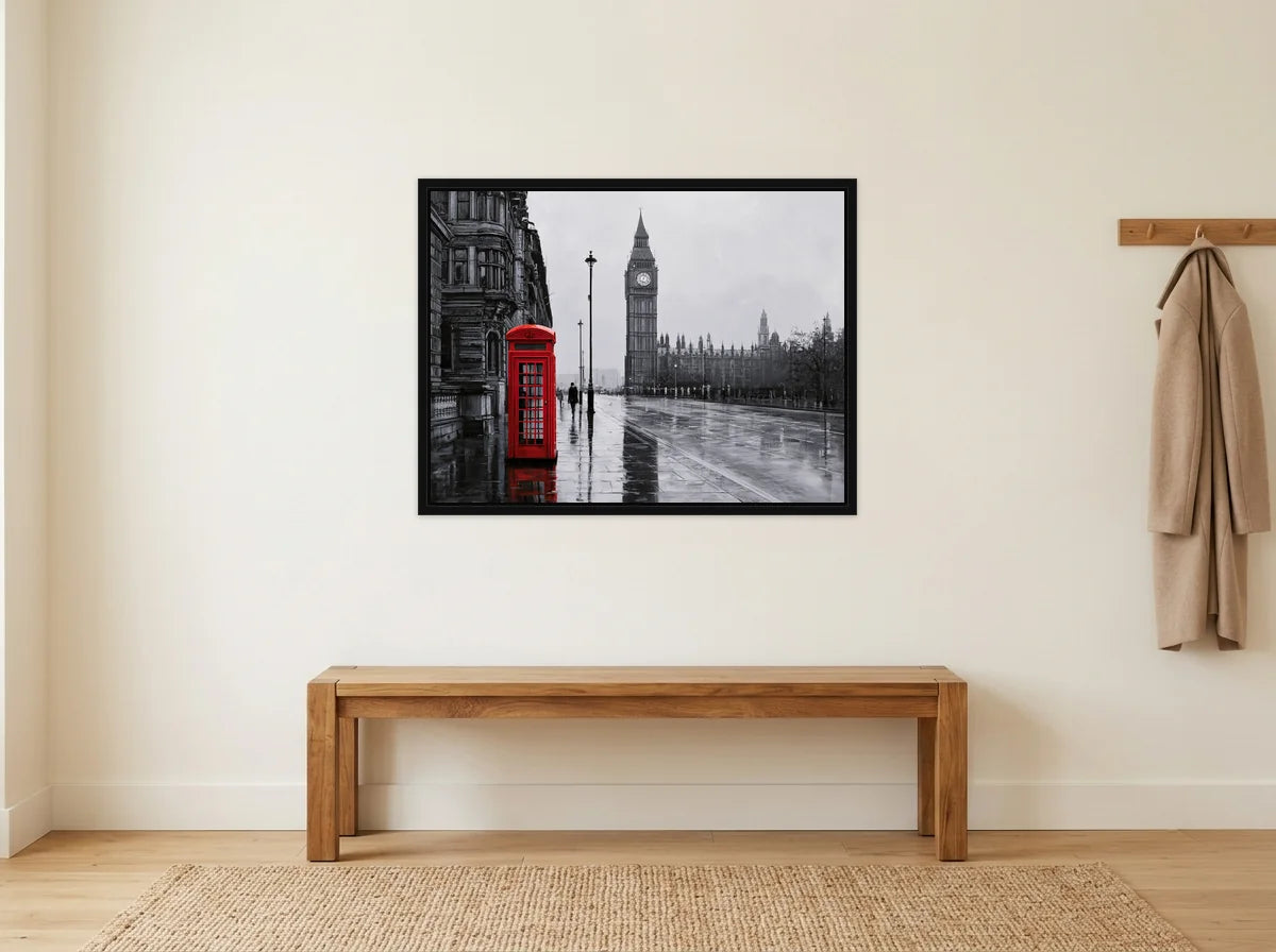 Tableau Big Ben et cabine rouge noir et blanc en toile encadrée noire, présenté dans une entrée crème avec banc en bois