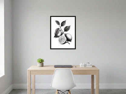 Tableau citrons sur branche noir et blanc en toile encadrée noire, présenté dans un bureau gris clair lumineux