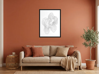 Tableau courbes topographiques organiques noir et blanc en toile encadrée noire, présenté dans un intérieur chaleureux