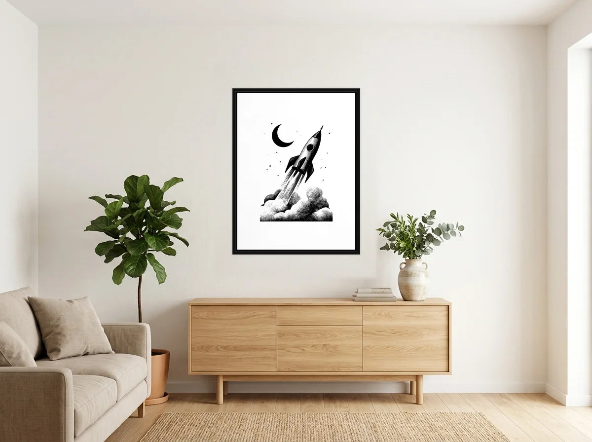 Tableau fusée et croissant lunaire noir et blanc en toile encadrée noire, présenté dans : salon blanc chaleureux et bois clair