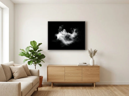 Tableau nébuleuse cosmique noir et blanc en toile encadrée noire, présenté dans un salon blanc chaleureux