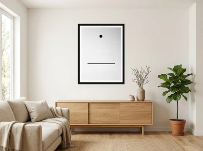Tableau point et ligne minimalistes noir et blanc en toile encadrée noire, présenté dans un intérieur chaleureux