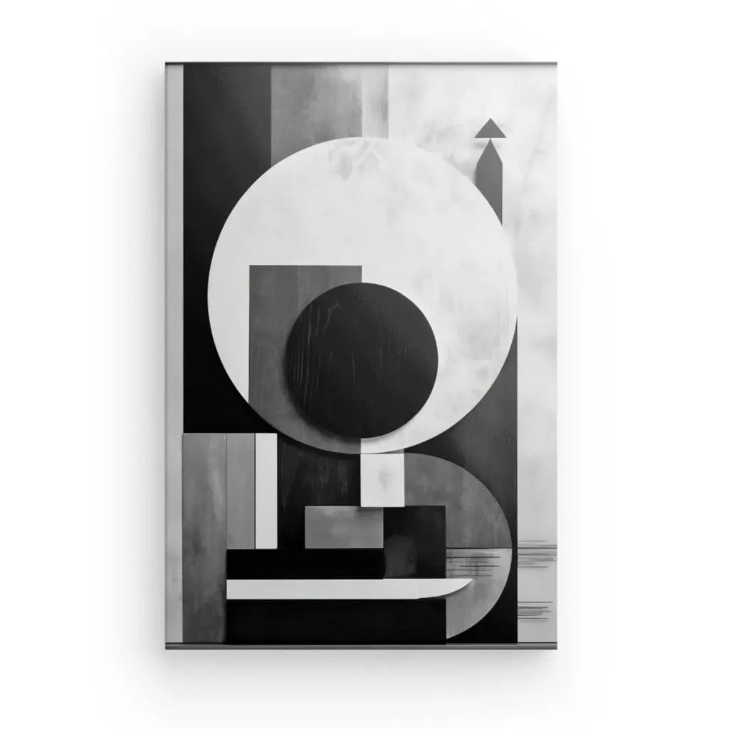 Un Tableau Géométrique Abstrait Contrastes Cubisme Noir et Blanc présente des formes géométriques comme des cercles, des rectangles et des lignes, affichées dans un cadre blanc sur un fond blanc, faisant écho à l'essence du cubisme et de l'art moderne.