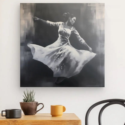 Un Tableau Danseuse Noir et Blanc Peinture Monochrome représentant une danseuse vêtue d'une robe fluide est accroché sur un mur blanc au-dessus d'une table en bois avec une plante en pot et deux tasses.